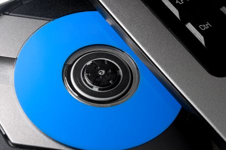 notebook with opened dvd romの写真素材