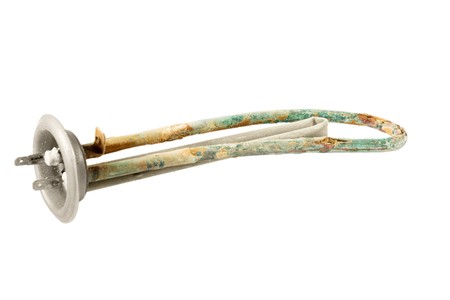 Limescale on the heating element isolated on whiteの写真素材