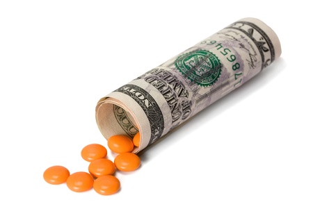 drugs in dollar isolated on white backgroundの写真素材