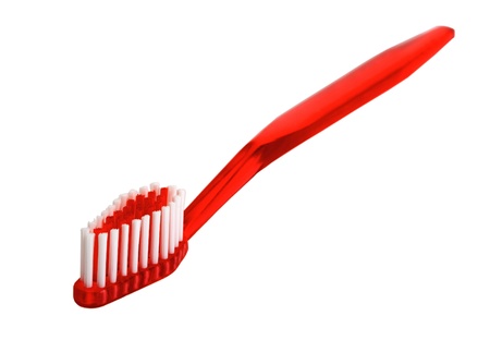 red toothbrush isolated on the background red toothbrush isolated on the background