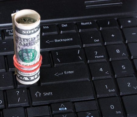 Computer keyboard and dollar money backgroundの写真素材