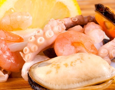 Sea food - closeup boiled prawns ,shrimp and octopus background の写真素材