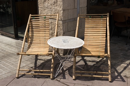 Beach chairs bamboo and table cafe on streetの写真素材