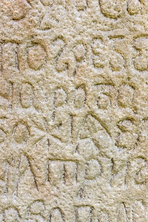 script carved into rock  Folk Arts museum Pirogovo, Kiev, Ukraine 