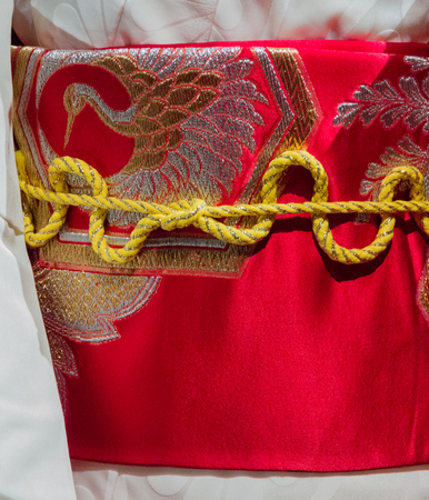 Vintage Japanese rope, belt and crane on silk kimono womanの写真素材