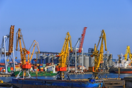 tanker and container cargo ships docked in port