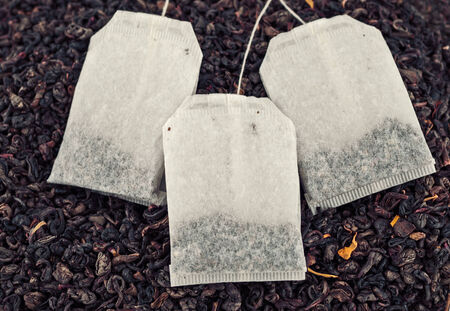 Dry tea and tea bags backgroundの写真素材