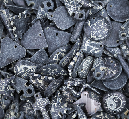 Vintage talismans amulets old shapes and zodiac on stone set backgroundの写真素材