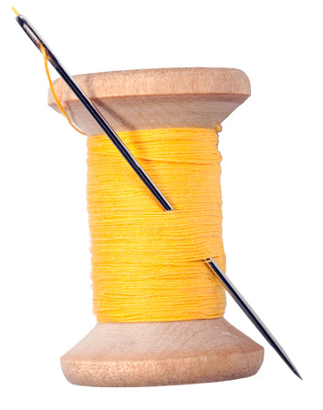 thread and needle isolated on white backgroundの写真素材