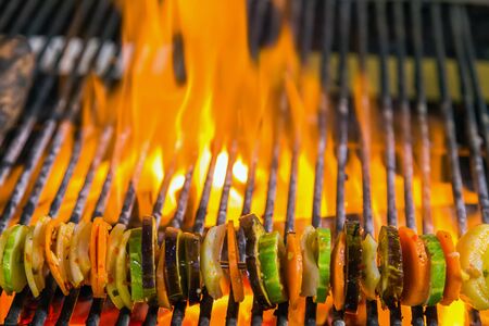 vegetable by fire and BBQ Flames. Restaurant Barbecue at the night marketの写真素材