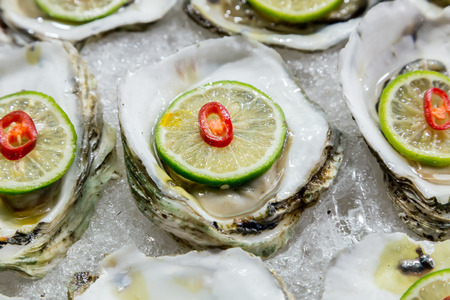 scallop shell on ice exposition sea market. Seafood on iceの写真素材
