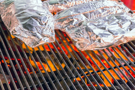 food in aluminum Foil, Barbecue Grill cooking background eat Restaurantの写真素材
