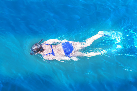 women snorkeling in the tropical water