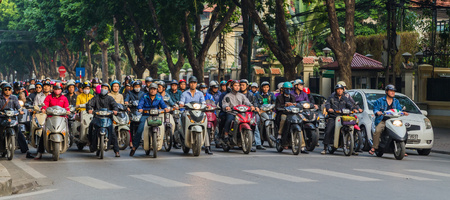 HANOI, VIETNAM - NOV 20, 2014: Life in Vietnam - Street by moto bike is an essential part of life in Vietnam, traffic of Asian city in rush hour,  of people in motorcycles.のeditorial素材