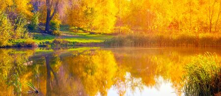 Autumn wide lake reflection water in morningの写真素材