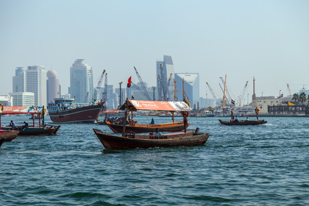 DUBAI, UAE - JANUARY 23: Boats Abra ferries on the Bay Creek in Dubaii, UAE circa January 2016のeditorial素材
