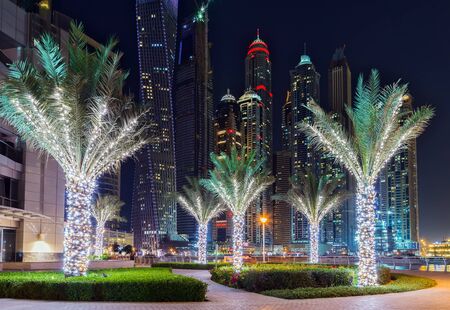 DUBAI, UAE - JANUARY 24: Dubai famous Marina buildings skyscrapers in night palm, circa January 2016のeditorial素材
