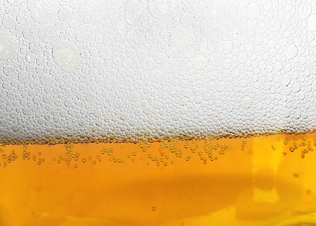 drops on glass of beer background texture. Beers bubbles