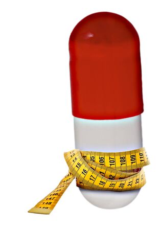 Red Pill dose Measure tape with diet on white backgroundの写真素材
