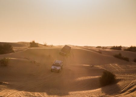 DUBAI, UNITED ARAB EMIRATES - JANUARY 25, 2016: Safari rally off-road car 4x4 adventure driving in the desert sand dune is a popular activity among tourists in Dubai.のeditorial素材