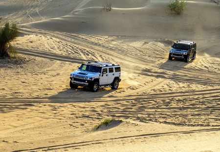 DUBAI, UNITED ARAB EMIRATES - JANUARY 25, 2016: Safari rally off-road car 4x4 adventure driving in the desert sand dune is a popular activity among tourists in Dubai.のeditorial素材