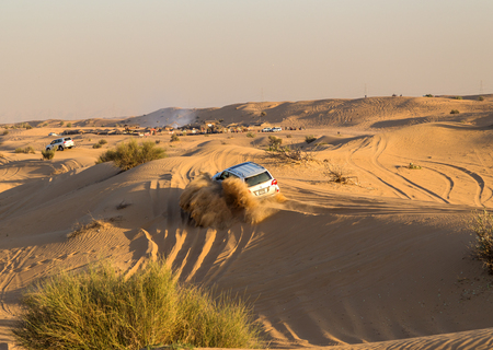 DUBAI, UNITED ARAB EMIRATES - JANUARY 25, 2016: Safari rally off-road car 4x4 adventure driving in the desert sand dune is a popular activity among tourists in Dubai.のeditorial素材