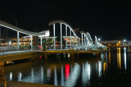 BARCELONA, SPAIN - AUGUST 27, 2012: Marina night Port Vell and the Rambla del Mar an area of sports boats, dock and a shopping area. Catalonia, Spain.のeditorial素材