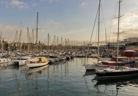 BARCELONA, SPAIN - AUGUST 27, 2012: Port Vell old harbor of Barcelona with an area of sports boats, dock and a shopping area. Catalonia, Spain.のeditorial素材