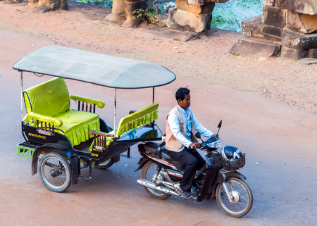 Siem Reap, Cambodia - 01 MARCH, 2015: Asian rickshaw Taxi in Cambodia Tuk Tuk of Angkor Wat, Khmer temple complex, Asia. のeditorial素材