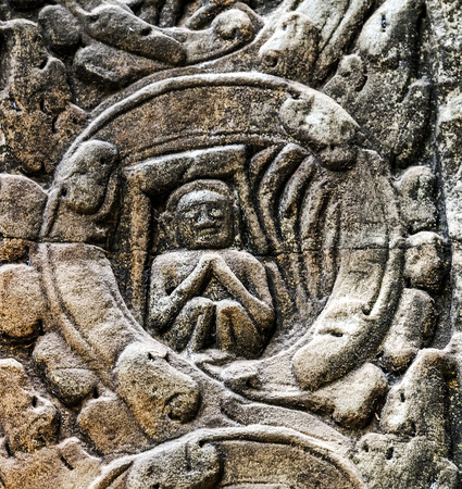 art of ancient Hindu god stone background, detail of the architecture in Bantey Srei temple in the Angkor area, Cambodia.の写真素材