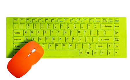 orange computer mouse green button key of keyboard isolated on the white background