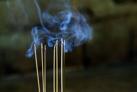 smoke of joss stick in chinese new year of incense in the spirit shrine.の写真素材