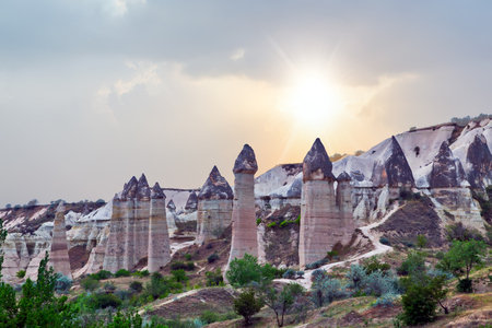 Rising Sun Rock volcanic formations Stone columns, mountain Love valley landscape, Turkey, Cappadocia. Goreme national park.の写真素材