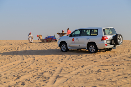 DUBAI, UNITED ARAB EMIRATES - JANUARY 25, 2016: Safari Toyota rally off-road car 4x4 adventure driving in the desert sand dune is a popular activity among tourists in Dubai.のeditorial素材