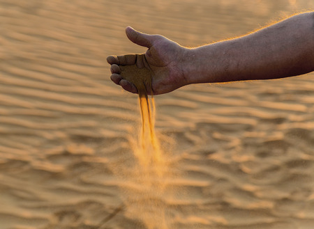 sand in hand of desert sun concept, Landscapes Beautiful Nature Backgroundの写真素材