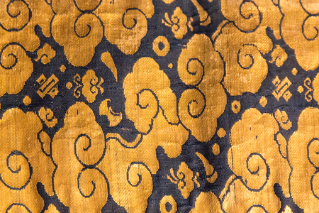 Vintage traditional japanese silk kimono Japan gold pattern on decorative background.