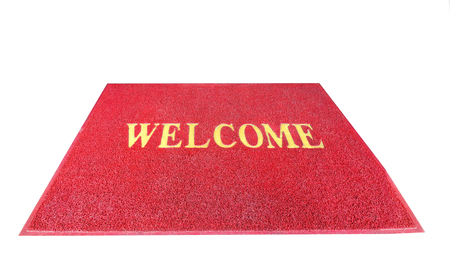 Red welcome carpet, mat threshold doormat isolated on white backgroundの写真素材