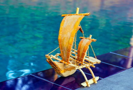 Popular landmark traditional souvenir sail fishing boat from Sri Lanka Bluewater Sailing pool beach.の写真素材