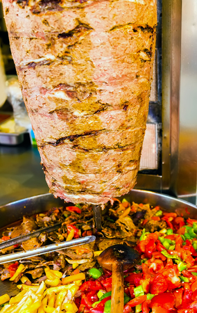 Istanbul street food Doner Kebab made of meat cooked on a vertical rotisserie. Shawarma meat grilled traditional Turkish dish that is eaten throughout Turkey Food.の写真素材