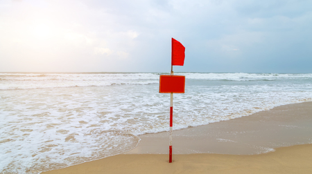 Beach red flag, danger waves seascape azure water in Blue ocean. Summer paradise beach, Danang, Vietnamの写真素材