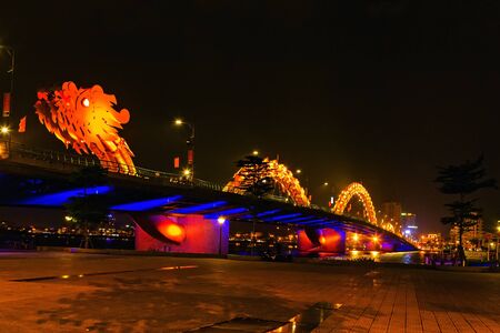 Dragon Bridge in the evening as it is illuminated with colourful LED lights, Han river in Da Nang, Vietnam.のeditorial素材