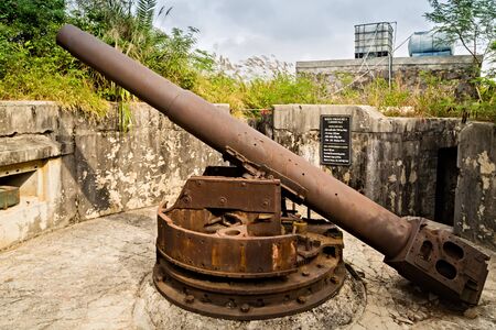 Cat Ba Island, Lan Ha Bay, Vietnam - November 30, 2014: Artillery gun 138 mm Cannon Fort. The Japanese built tunnels and gun posts World War II, French during the Indochina War, Viet Cong during the Vietnam War.のeditorial素材