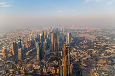 DUBAI, UAE - January 23, 2016: Dubai architecture at daytime with Burj Khalifa and Sheikh Zayed road, shot from the tower Burj Khalifaのeditorial素材