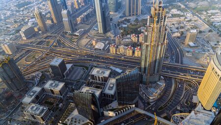 DUBAI, UAE - January 23, 2016: Downtown Dubai architecture at daytime with Burj Khalifa and Sheikh Zayed road, shot from the tower Burj Khalifaのeditorial素材
