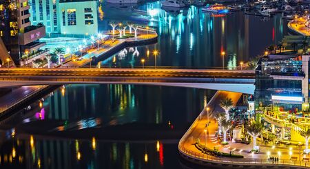Dubai, UAE - January 24, 2016: Dubai Marina aerial panoramic view cityscape by night, illuminated skyscrapers bridge and the persian gulf.のeditorial素材