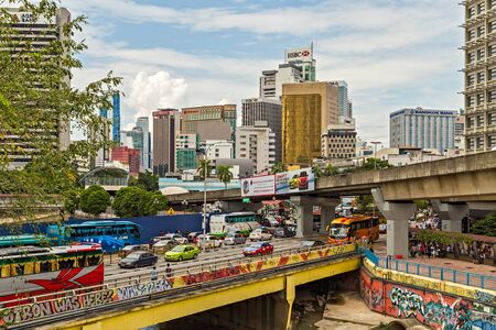 Kuala Lumpur, Malaysia - February 20, 2015: Frame building architecture city panoramic view skyline. Traffic cars taxi Kuala Lumpur (KL) capital of Malaysia.のeditorial素材