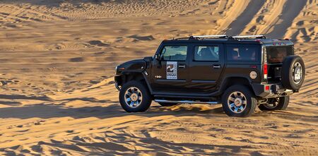 DUBAI, UNITED ARAB EMIRATES - JANUARY 25, 2016: Hummer H2 rally off-road car 4x4 Sand desert...