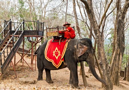 SIEM REAP, CAMBODIA - March 01, 2015: Tourists on an ride elephant Bayon temple in Angkor Thom is a popular tourist attraction ancient Khmer temple ruins in Siem Reap, Cambodiaのeditorial素材
