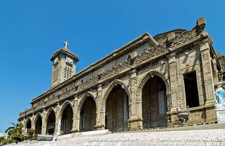 Nha Trang, Vietnam - February 11, 2015: Outside, Cathedral of Nha Trang are decorated with numerous statues of saints as well as 4,000 tombstones mounted on the sides. Catholic St. Mary'sのeditorial素材