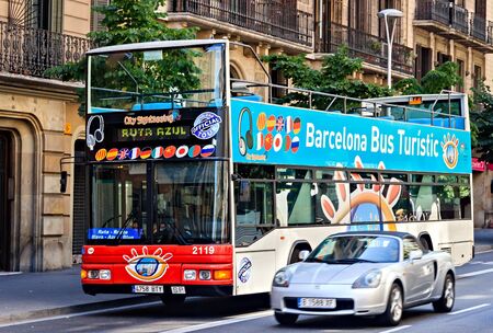 BARCELONA, SPAIN - August 01, 2012: Barcelona City Tour red touristic bus, double-decker buses attractions service audio guideのeditorial素材